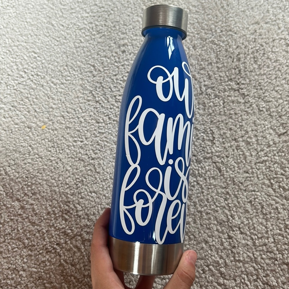 Blue 22oz with white out family is forever